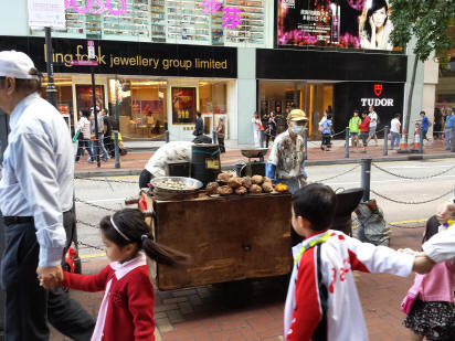 Bustling Paterson Street in Causeway Bay with local street vendors, traditional shops, and authentic Hong Kong dining atmosphere